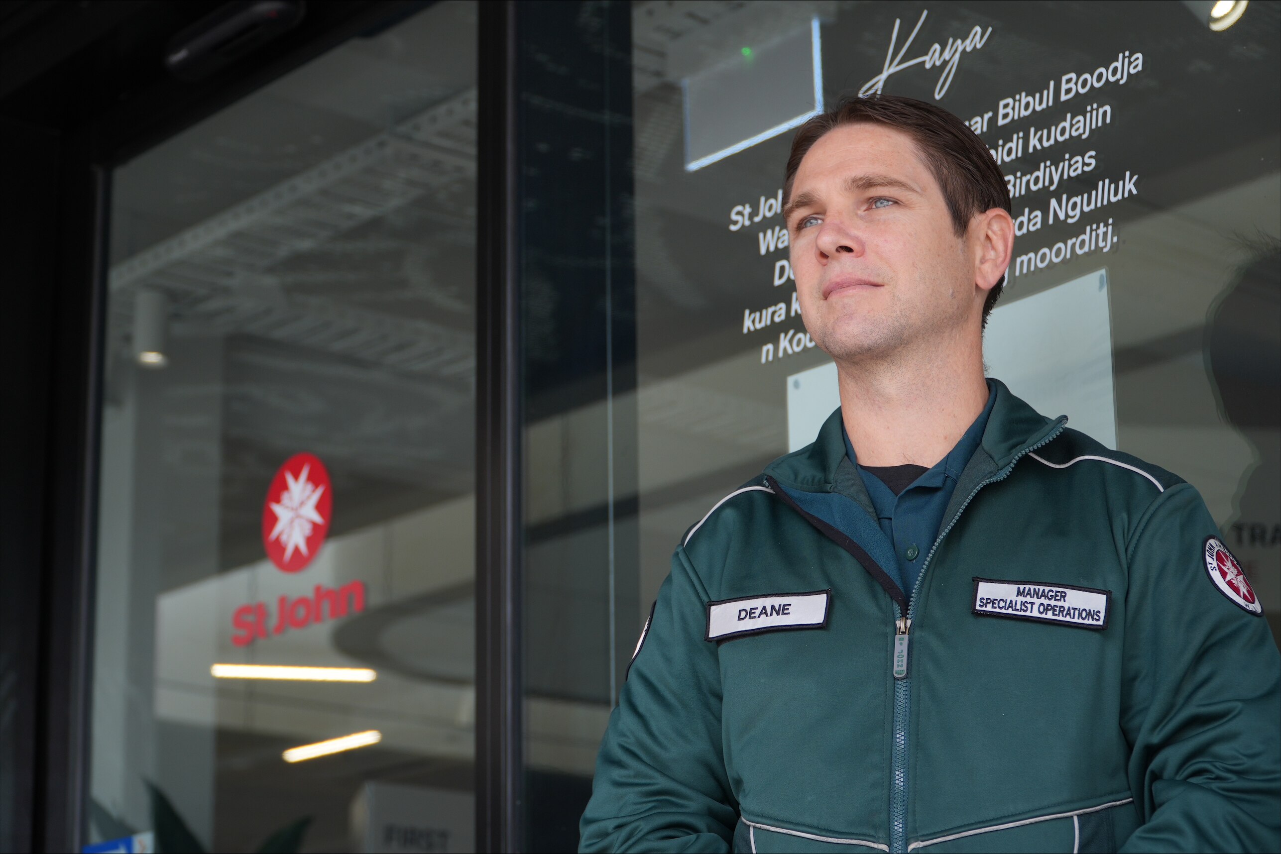 A paramedic looks serious.