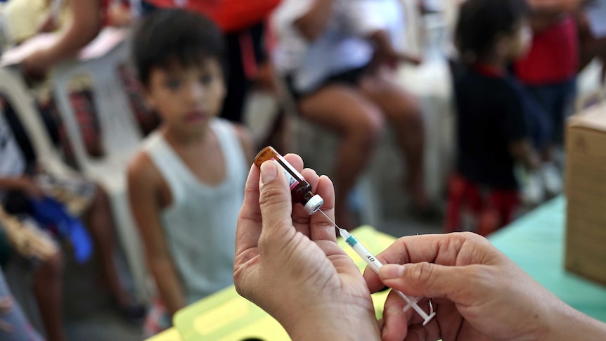 Red Cross working on a measles vaccination campaign