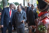Kevin Rudd and Papua New Guinea's prime minister Peter O'Neill watch traditional dancers in Port Moresby on July 15, 2013