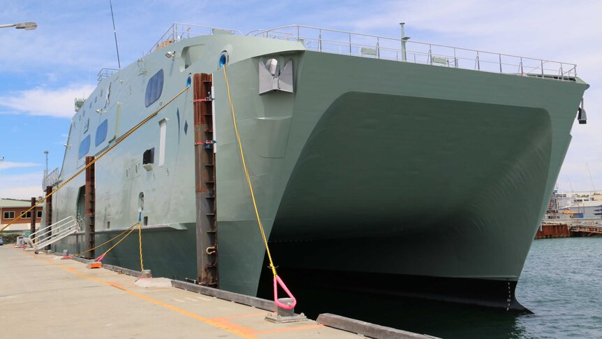A vessel built by Austal for Oman sits at dock in Henderson, south of Perth.