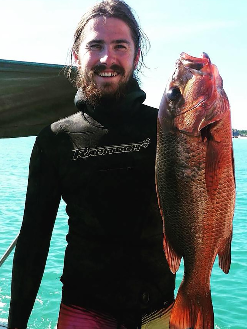 A photo of Karl Waters holding a big fish.