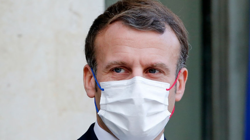 Emmanuel Macron wearing a mask