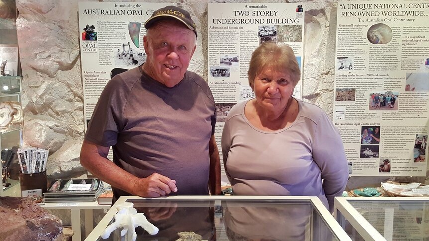 Opal miner Bob Foster and his wife Jenny visit the dinosaur bones at the Australian Opal Centre.