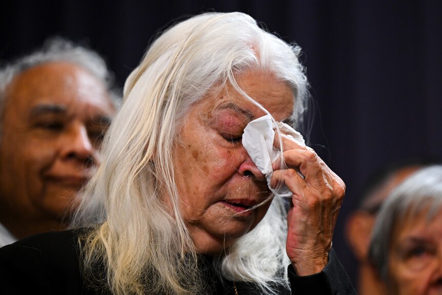 Marcia Langton holds a tissue to her eyes and cries