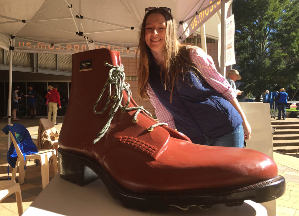 Boots for Change founder Emma Mott with an oversized boot.