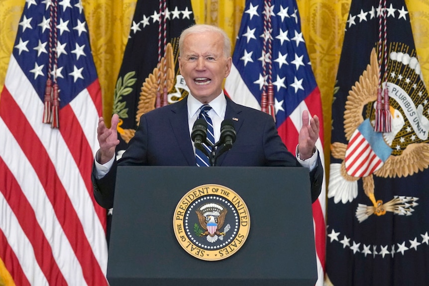US President Joe Biden gestures while giving a speech
