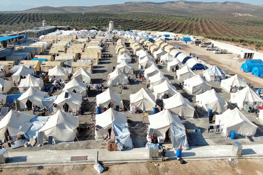 Rows of white tents. 