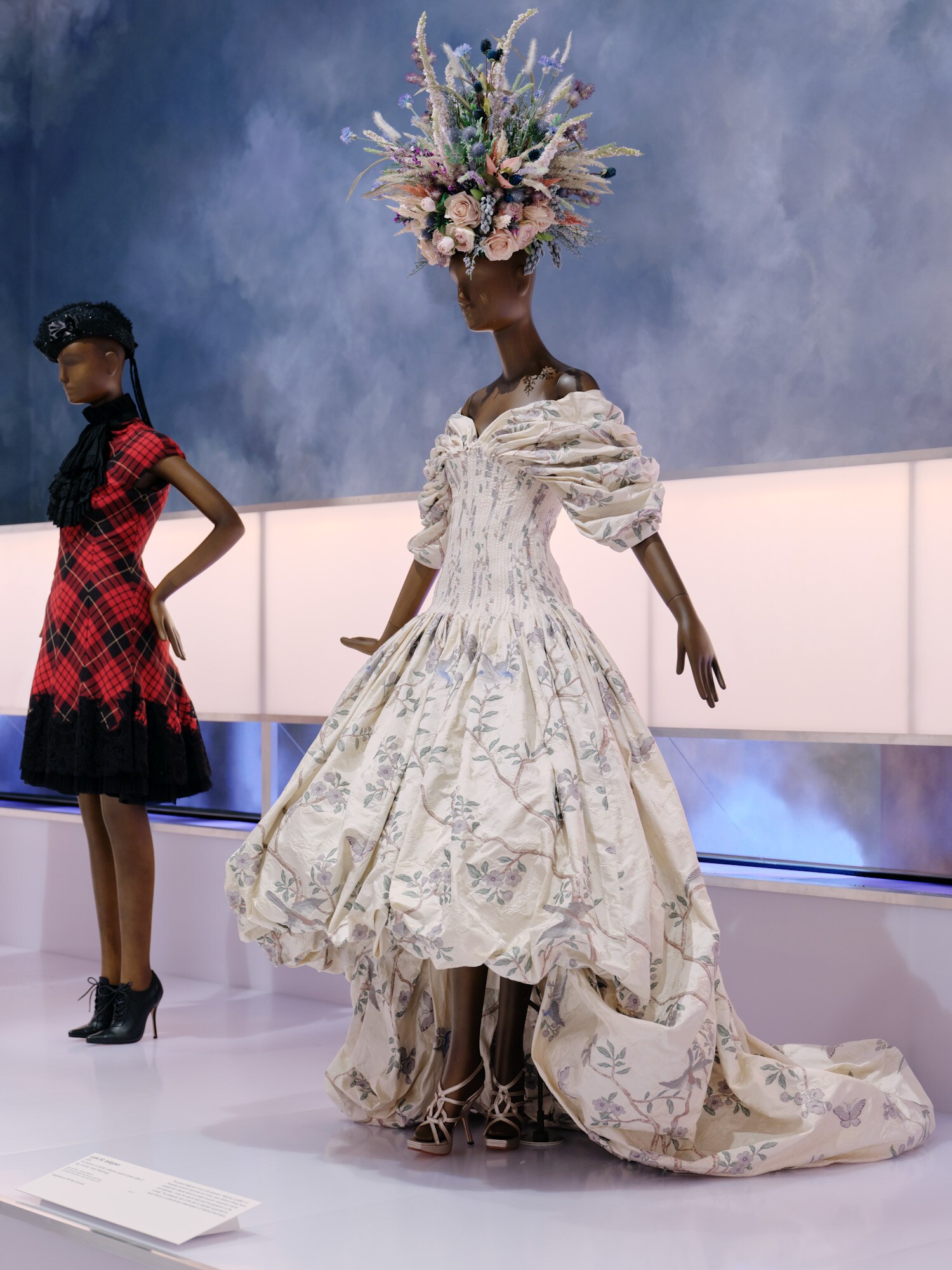Gallery view showing, in foreground, a mannequin wearing an elaborate ballgown.