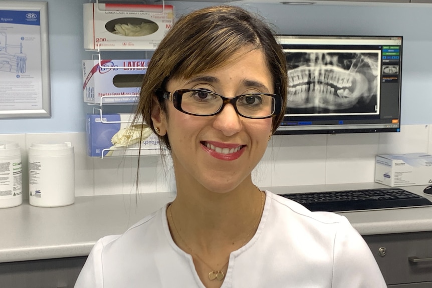 Dr Norah Ayad smiling at her dentistry clinic