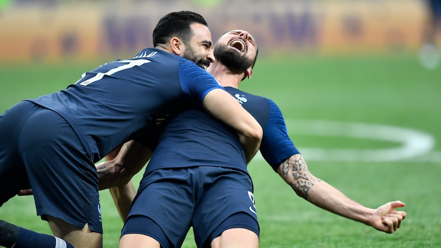 Olivier Giroud and Adil Rami celebrate winning the World Cup for France