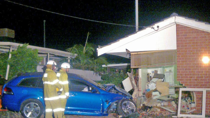 The car crashed into the kitchen of the house