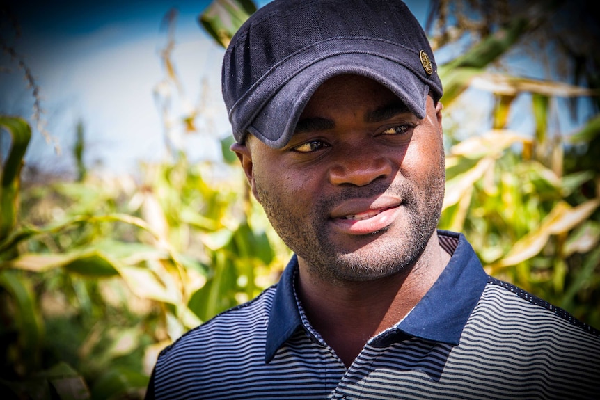 John Niyera stands in the maize crop