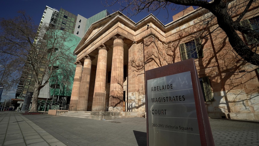 A large classical sandstone building with columns