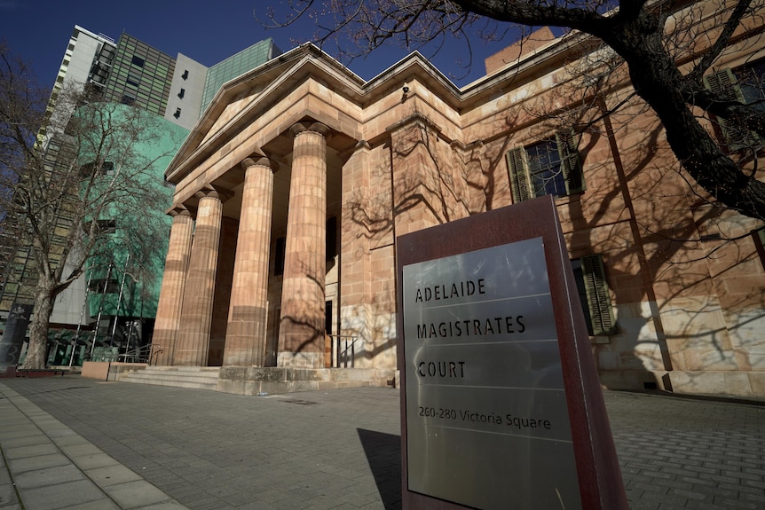 A large classical sandstone building with columns