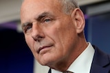 A close-up of John Kelly looking thoughtful.