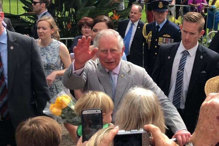 Prince Charles waves to the public