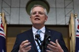 Scott Morrison is seen from a low angle while he is speaking.