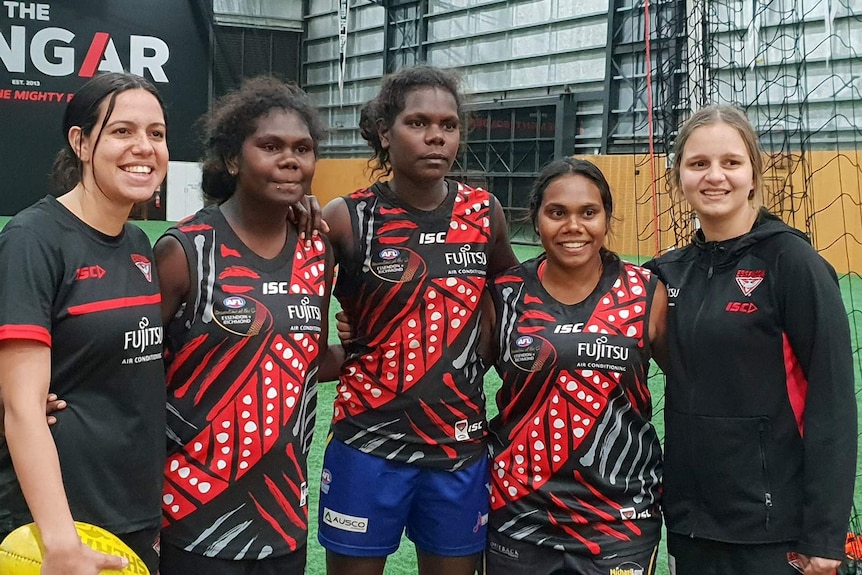 A group of Tiwi College school girls wearing Arthurina Moreen's guernsey.
