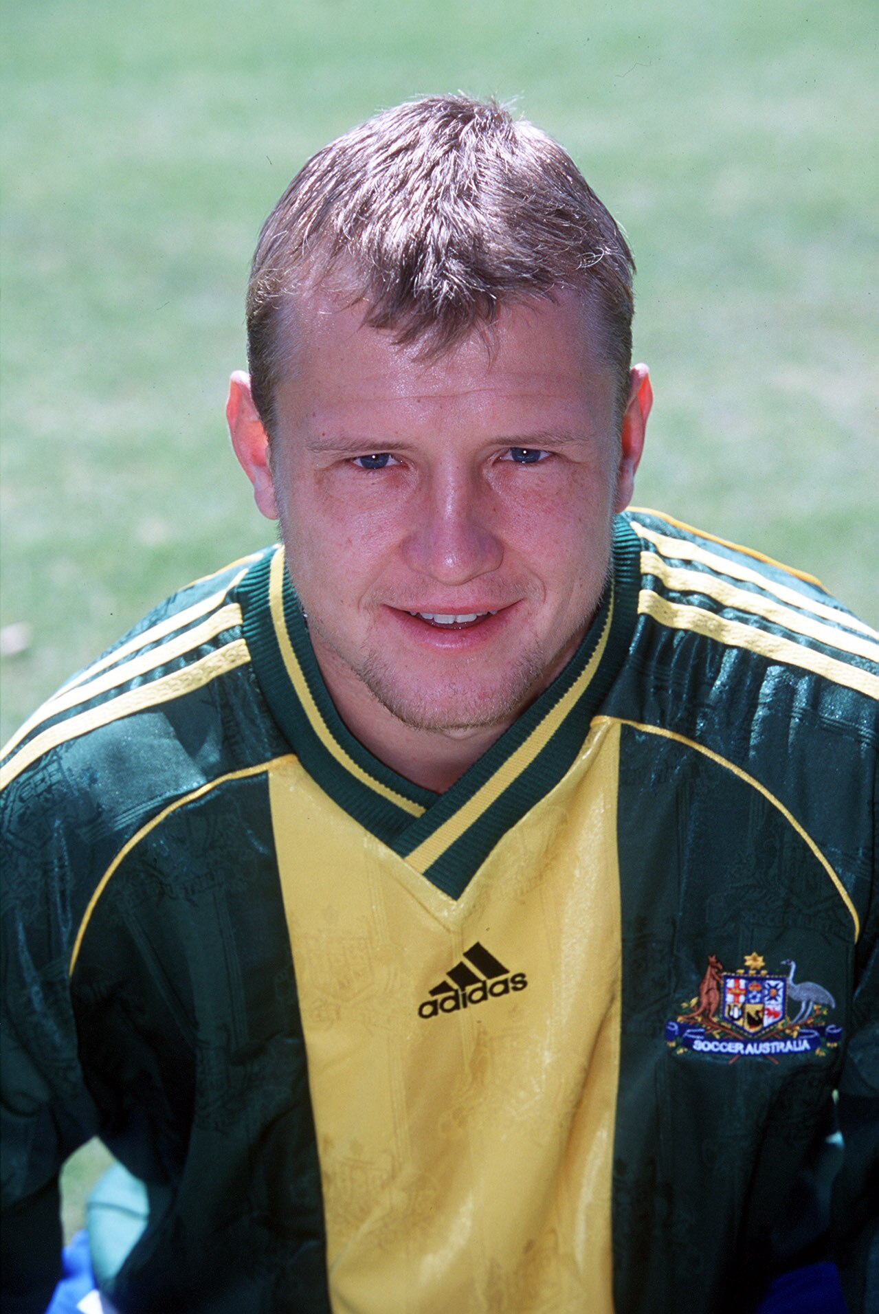 A profile of former Socceroo Stephen Laybutt in his playing kit smiling
