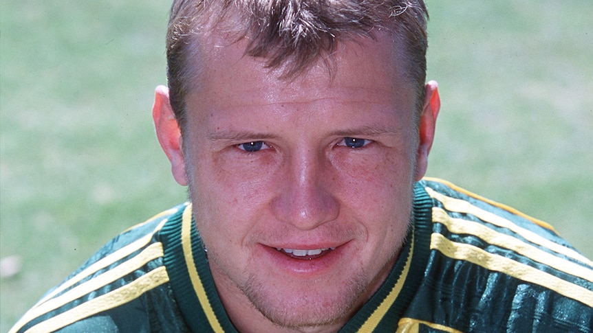 A profile of former Socceroo Stephen Laybutt in his playing kit smiling