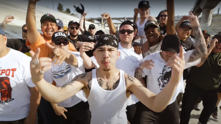 A gang of male hardcore fans perform to camera for Sydney band SPEED's 'One Blood We Bleed' video