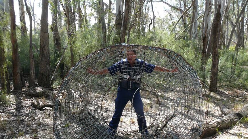 a huge net with a man standing with it