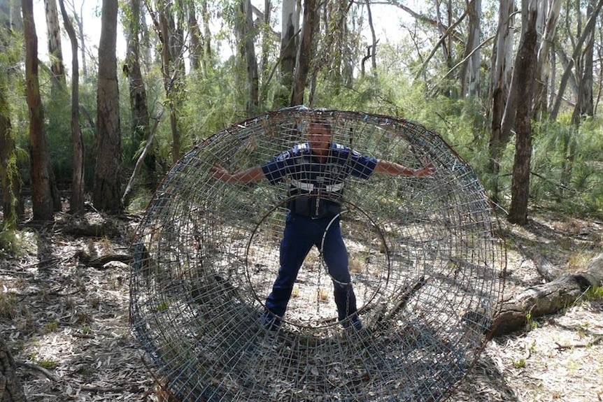 a huge net with a man standing with it