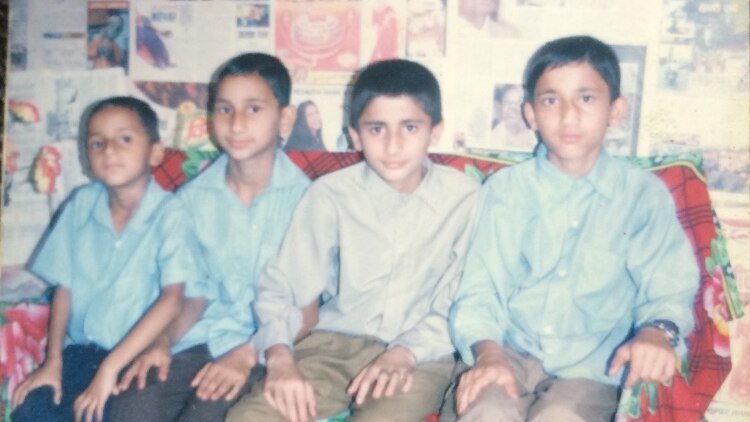 Narayan Khanal with his three older brothers to his left before they left the Nepalese refugee camp for Australia