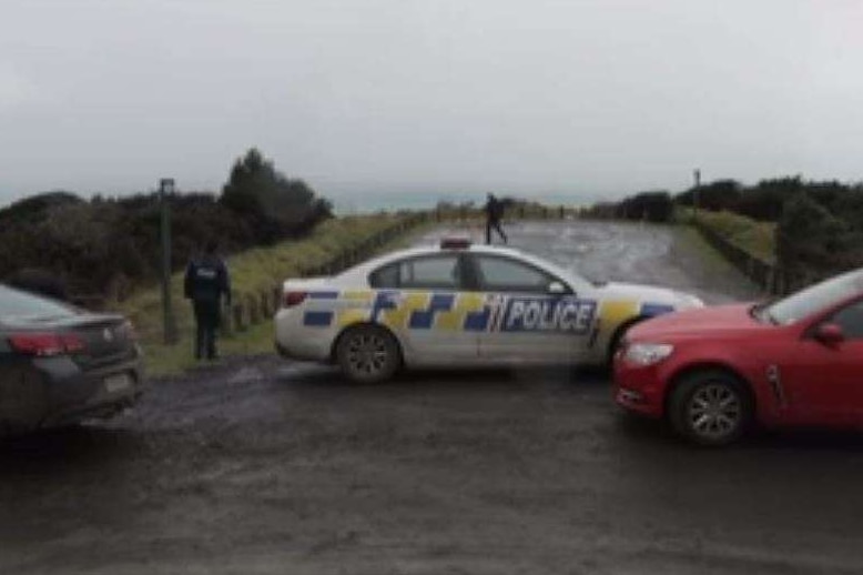 cars block a road in New Zealand