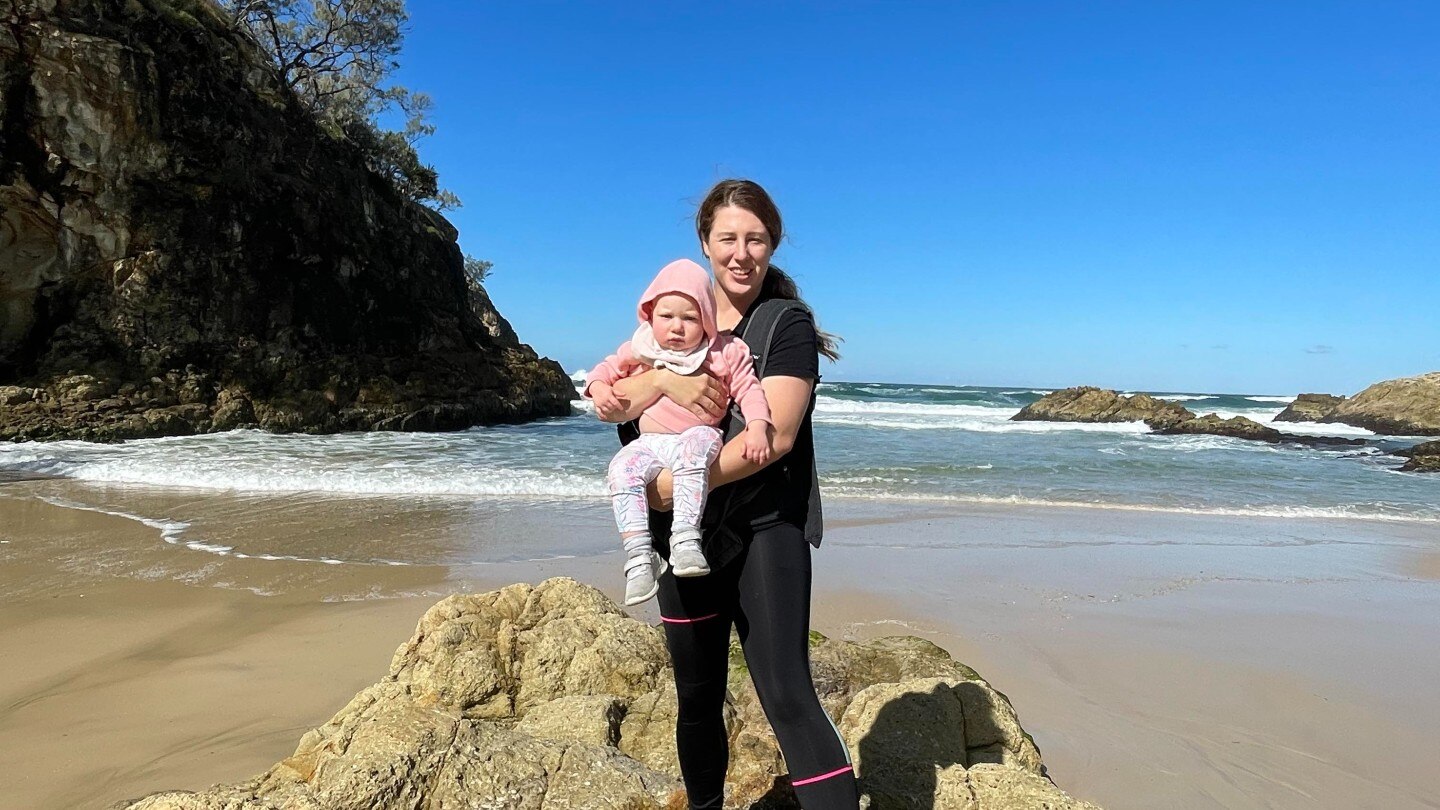 Sarah and baby daughter at the beach