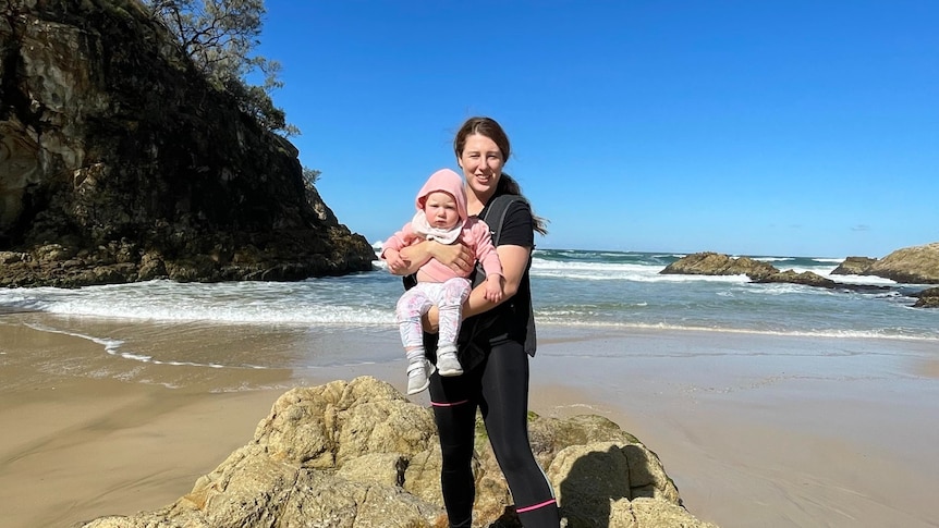 Sarah and baby daughter at the beach