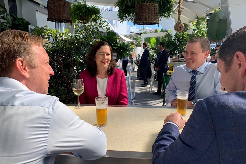 Annastacia Palaszczuk having a drink at a hotel with members of her government