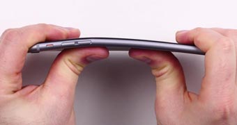 An iPhone 6 bends under some force