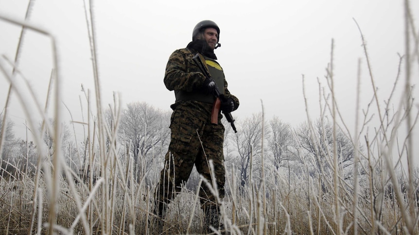A Ukrainian soldier takes position near Debaltseve