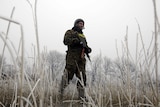 A Ukrainian soldier takes position near Debaltseve