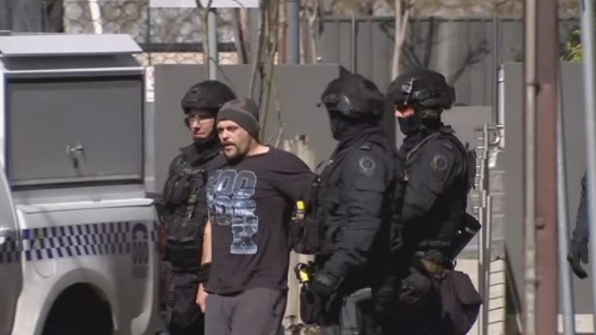Matthew Morrison is apprehended by police after Adelaide seige