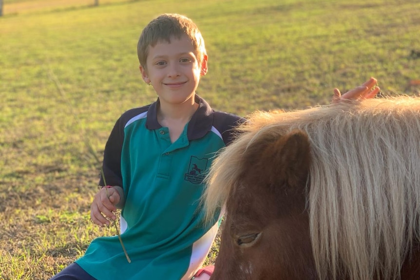 Ethan with a horse.