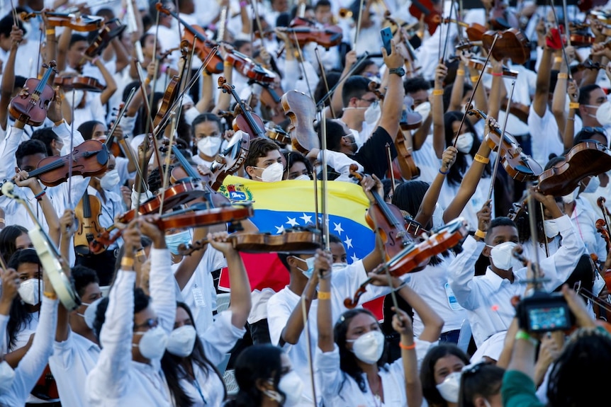Thousands of Musicians of Venezuela's National System of Youth Orchestras and Choirs take part in a concert .