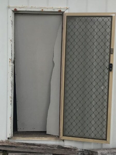 Image of a front door from a house damaged by an alleged burglar in Esperance.