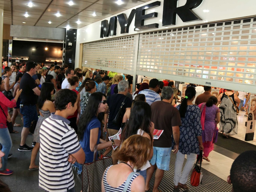 Crowds rush into a Perth department store at the start of the Boxing Day sales.