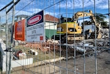 An excavator at a house building site at Jannali in Sydney's south sits idle.