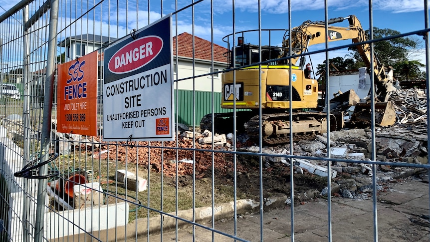 An excavator at a house building site at Jannali in Sydney's south sits idle.