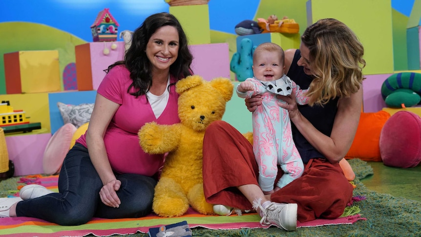 The Play School team with a baby on the episode about beginnings and endings.