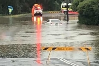 A car stuck in floodwaters in Narara, near Gosford