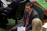 Victorian opposition leader Matthew Guy sits in State Parliament.