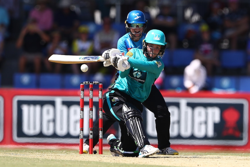 Georgia Redmayne prepares to reverse sweep with the wicketkeeper looking on over her shoulder