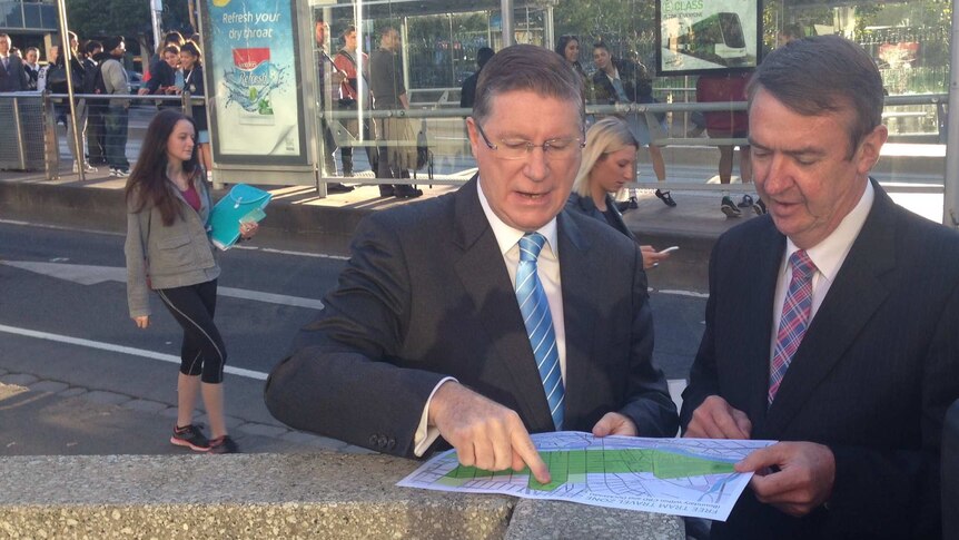 Denis Napthine and Terry Mulder looking at free tram map