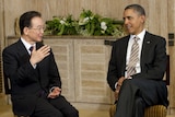 US president Barack Obama listens as Chinese premier Wen Jiabao speaks during talks in Bali.