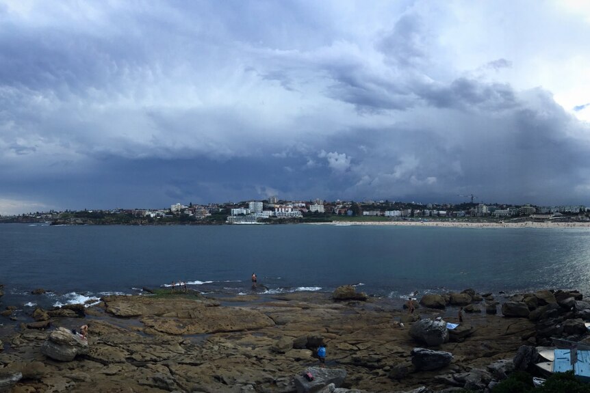 Storm clouds can be seen above Sydney