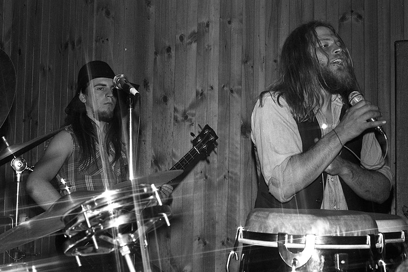 Black and white photo of a band playing live.